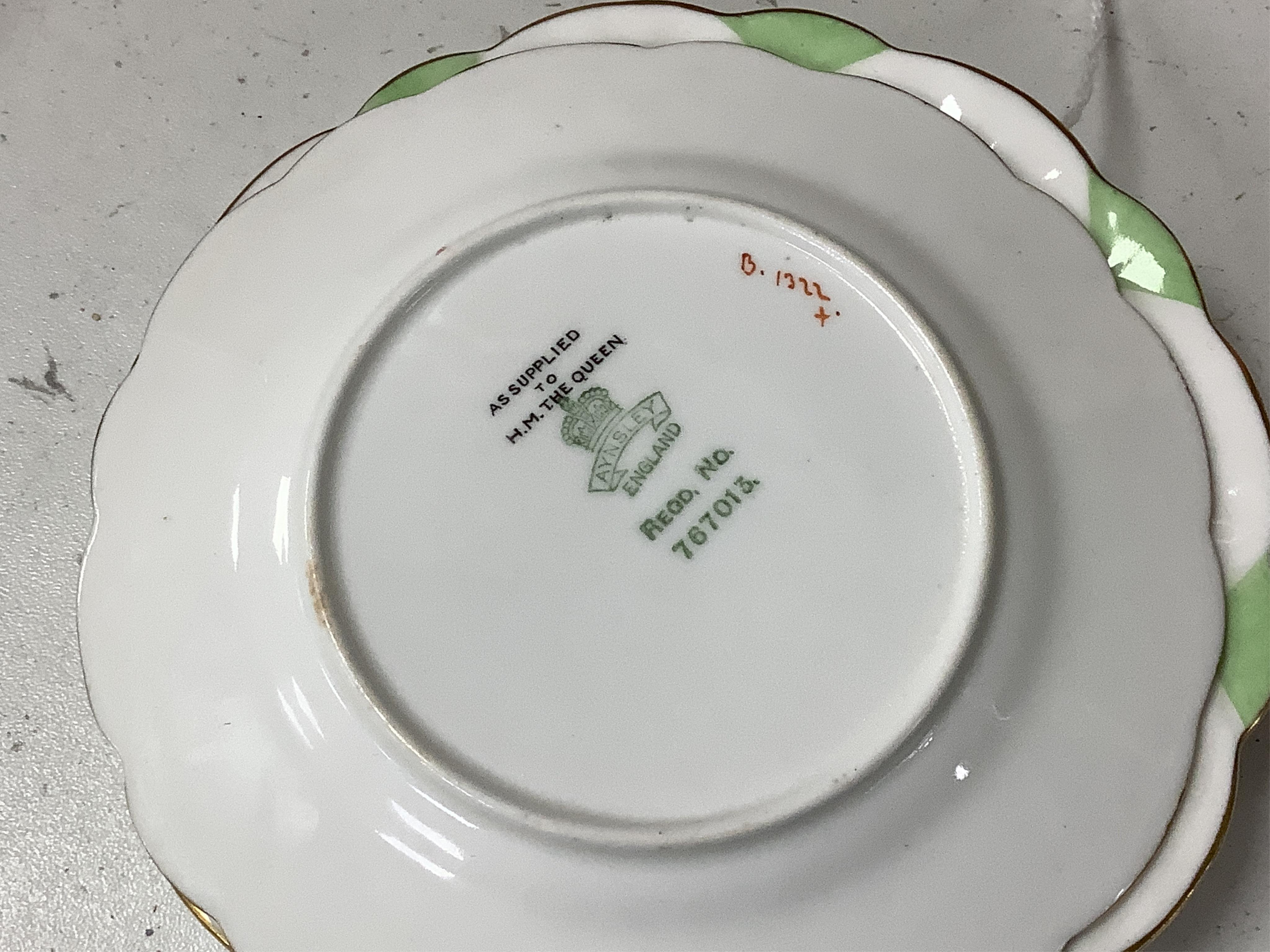 Two Aynsley trios with butterfly handles and one extra saucer, numbered 785788